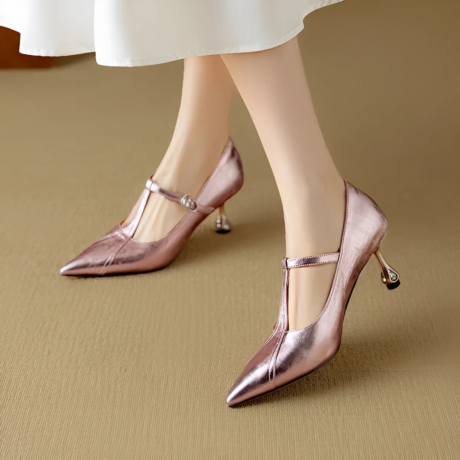 Women's gun coloured leather Mary Jane pumps with a chunky mid heel and pointed toe on a white background.