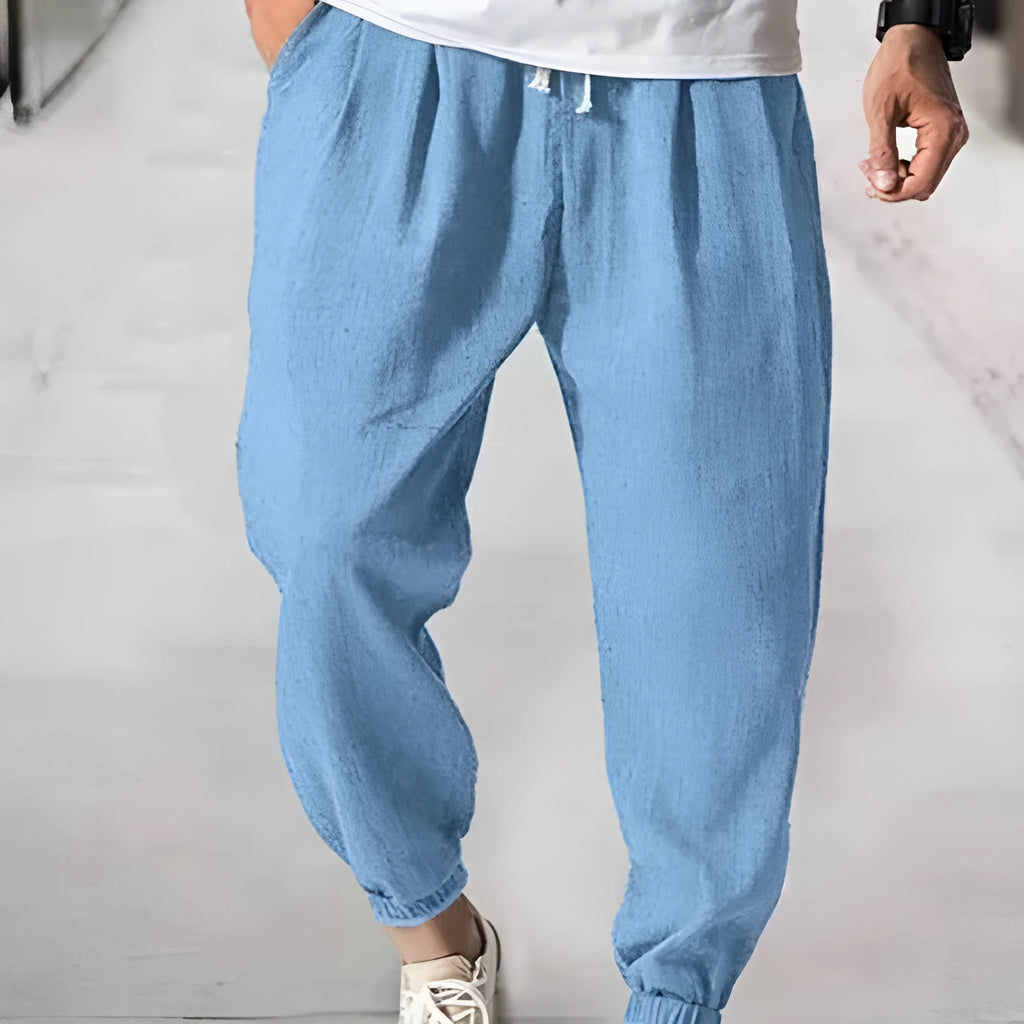 Men's loose cotton summer trousers with banded ankle cuff in light green colour