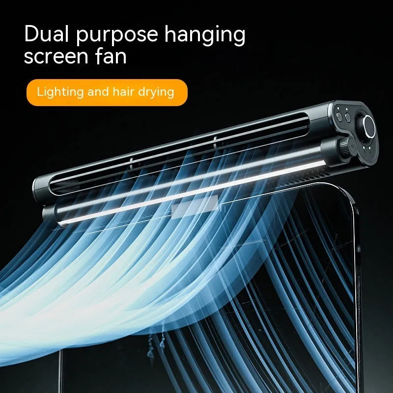 Black bladeless clip-on laptop fan with integrated lighting lamp attached to computer screen