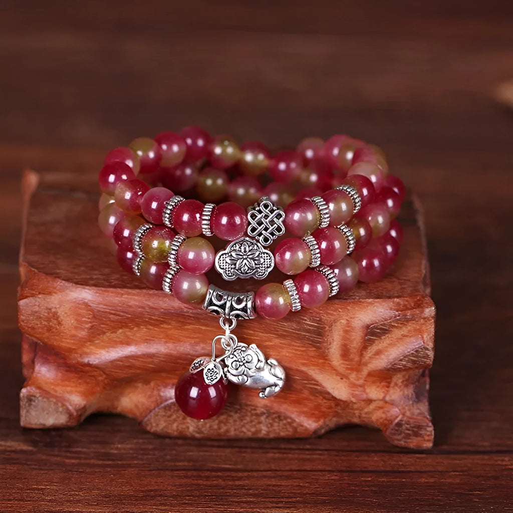Watermelon crystal bracelet with Chinese knot detailing in geometric national style design