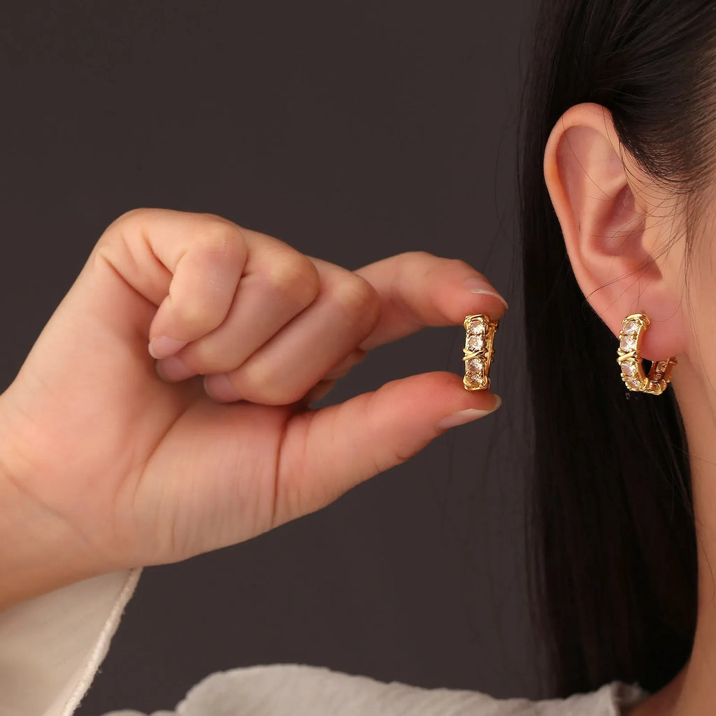 Geometric hexagonal clover cross earrings in silver or gold colour with electroplated finish and ellipse design details