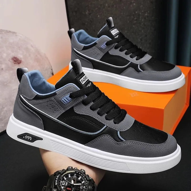 Men's low-top canvas shoes in black with leather stitching and mesh lining, shown on a white background.
