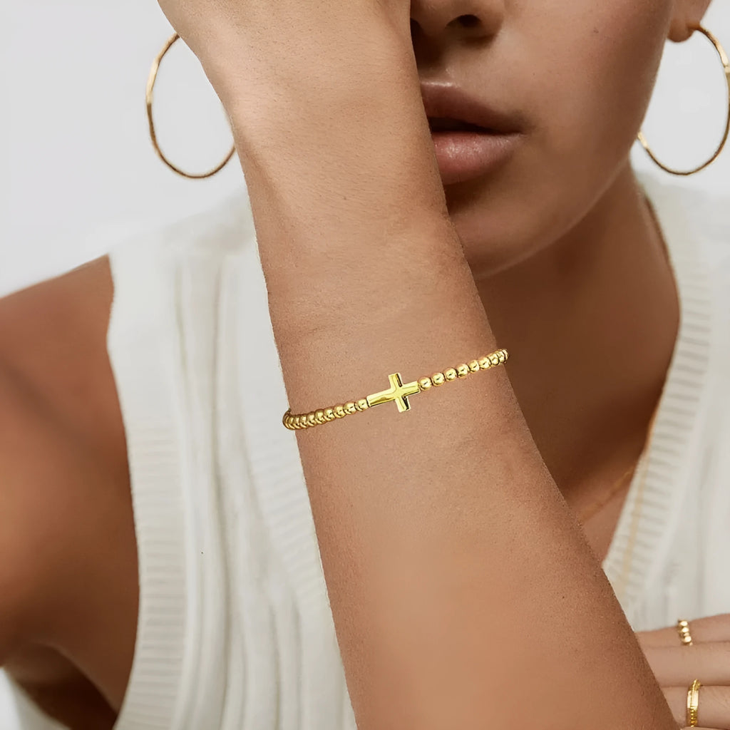 Women's adjustable stainless steel bracelet with a round geometric bead in a selection of colours.