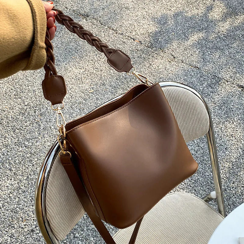 Retro woven PU leather unisex crossbody bucket bag in khaki colour.