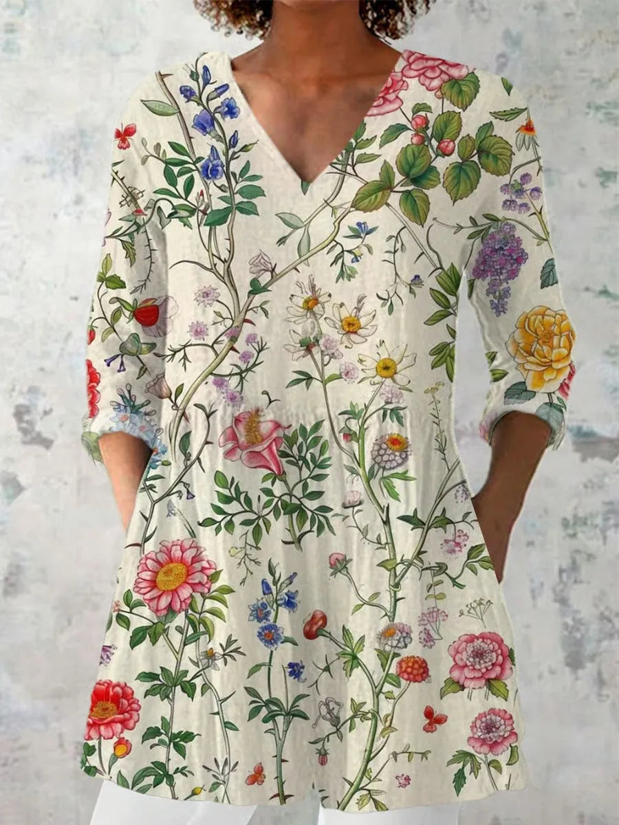 Women's retro style slim fit long-sleeved top with a printed design, shown on a hanger.