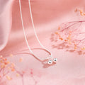 Silver cherry pendant necklace on an adjustable snake bones chain for women.