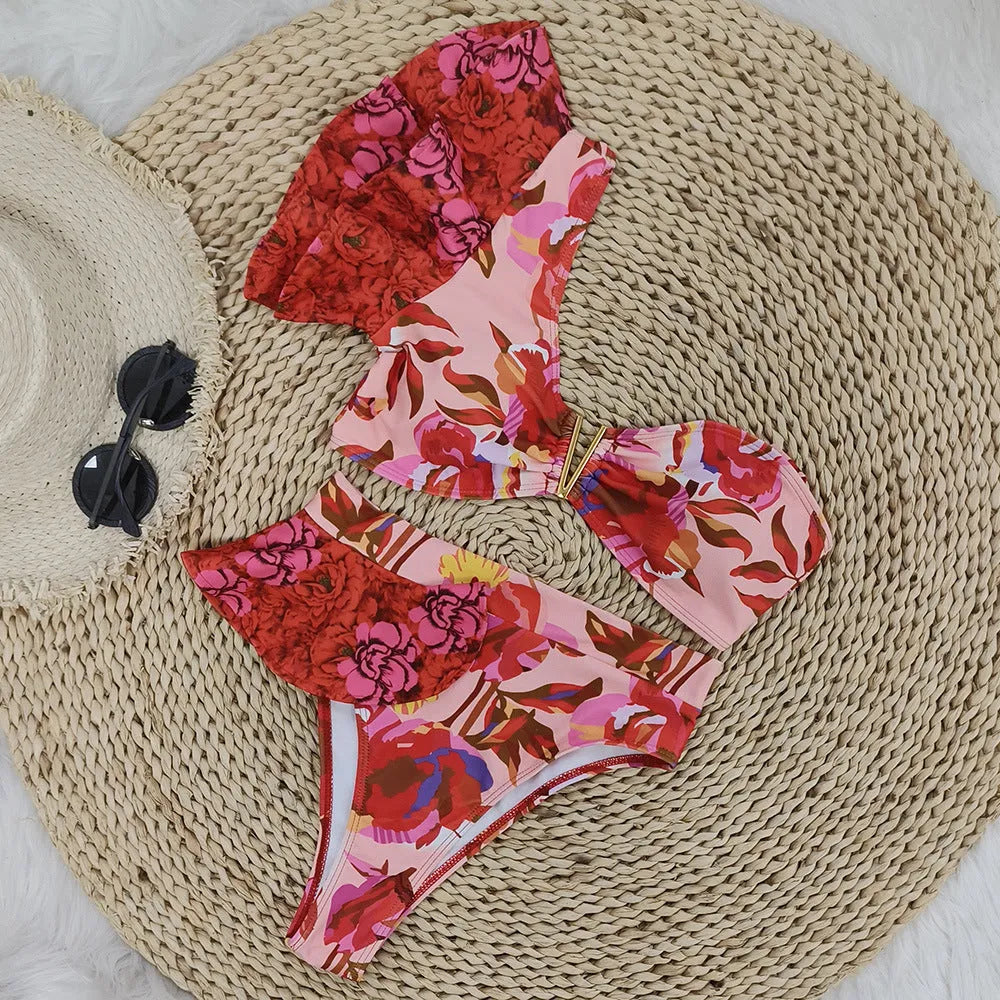 Pink floral print one-shoulder women's bikini swimsuit with high-waist briefs and ruffle trim