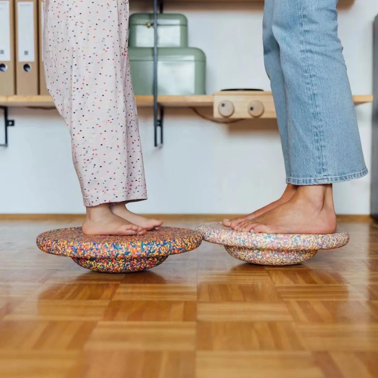 Children's plastic surf-shaped balance board in mixed wood colour and solid black option.