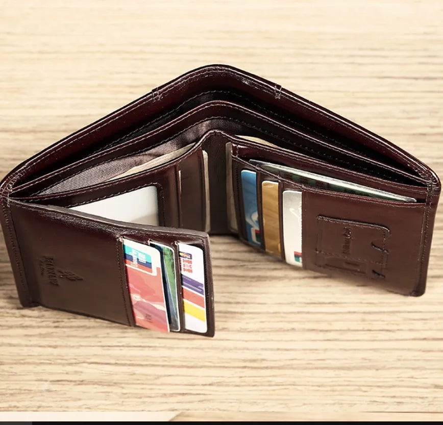 Men's black leather wallet open to show internal compartments: photo slot, card slots, banknote folder, and change pocket.