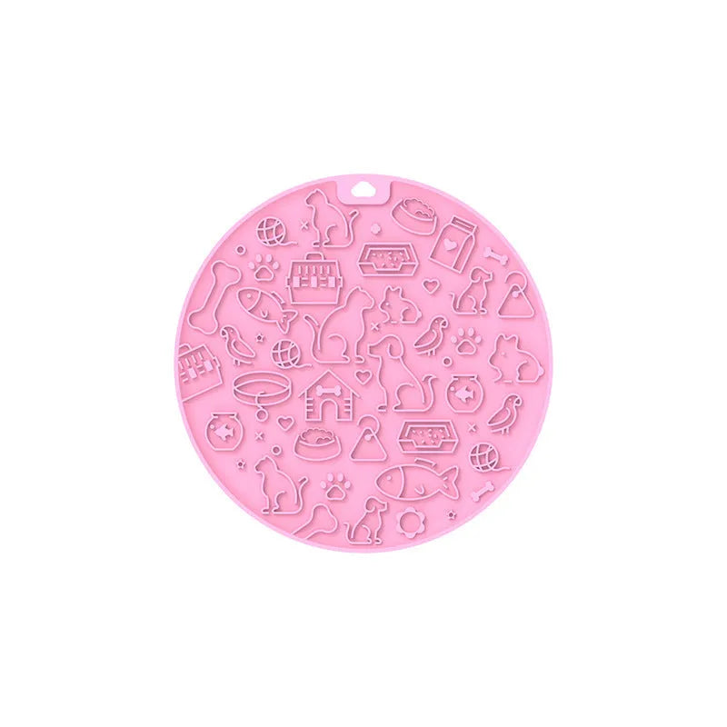 Round silicone pet licking mat with suction cup base in blue colour on smooth surface