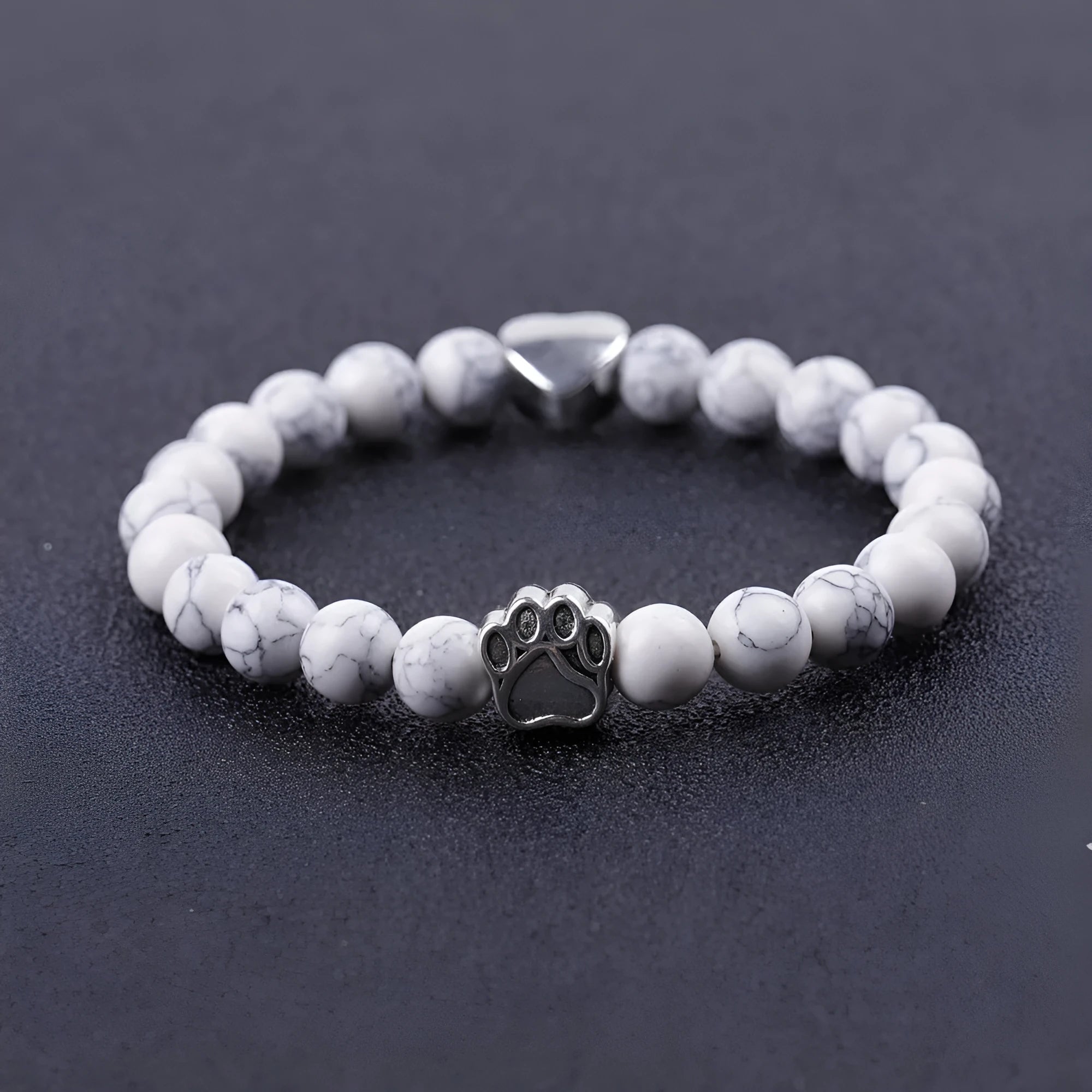 Tigereye Indian Agate stone beaded dog's paw bracelet on wrist, showing geometry shape and round beads.