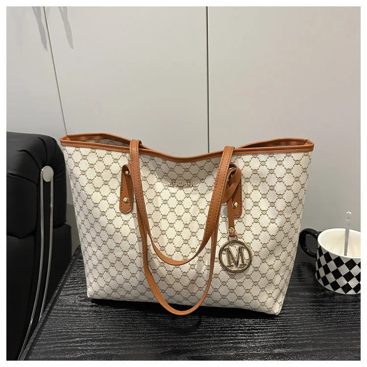PU leather street trend shoulder bag with sewing thread detail in a choice of colours.