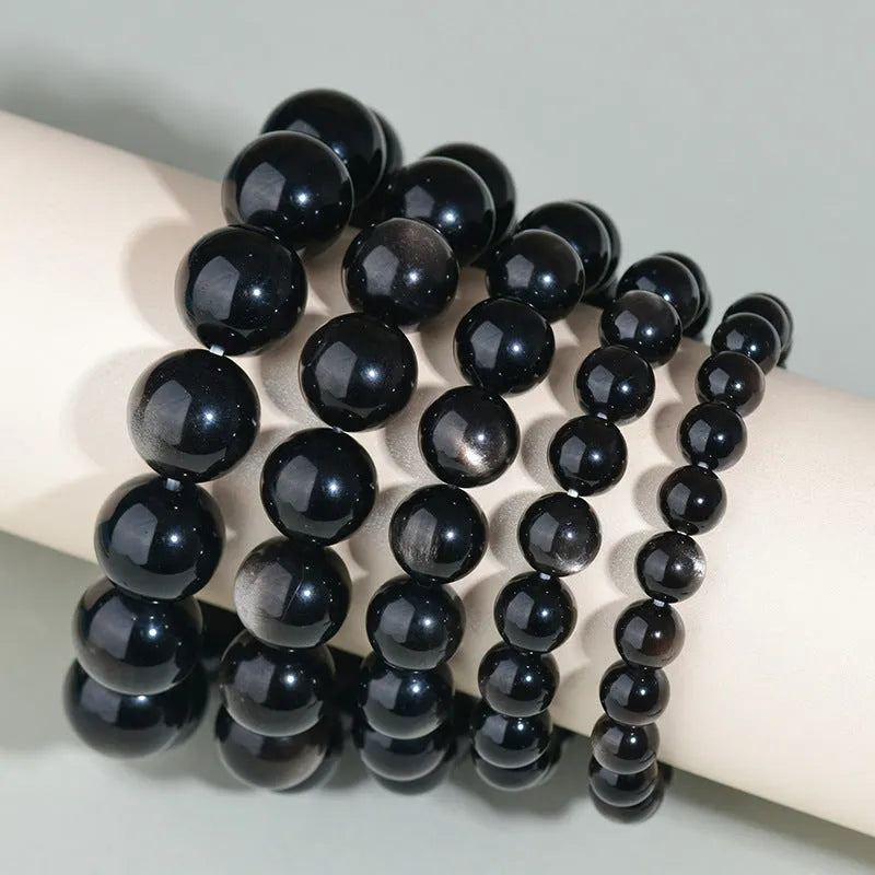 Hand-woven obsidian couple bracelet set with year of birth engraving in ethnic unisex style