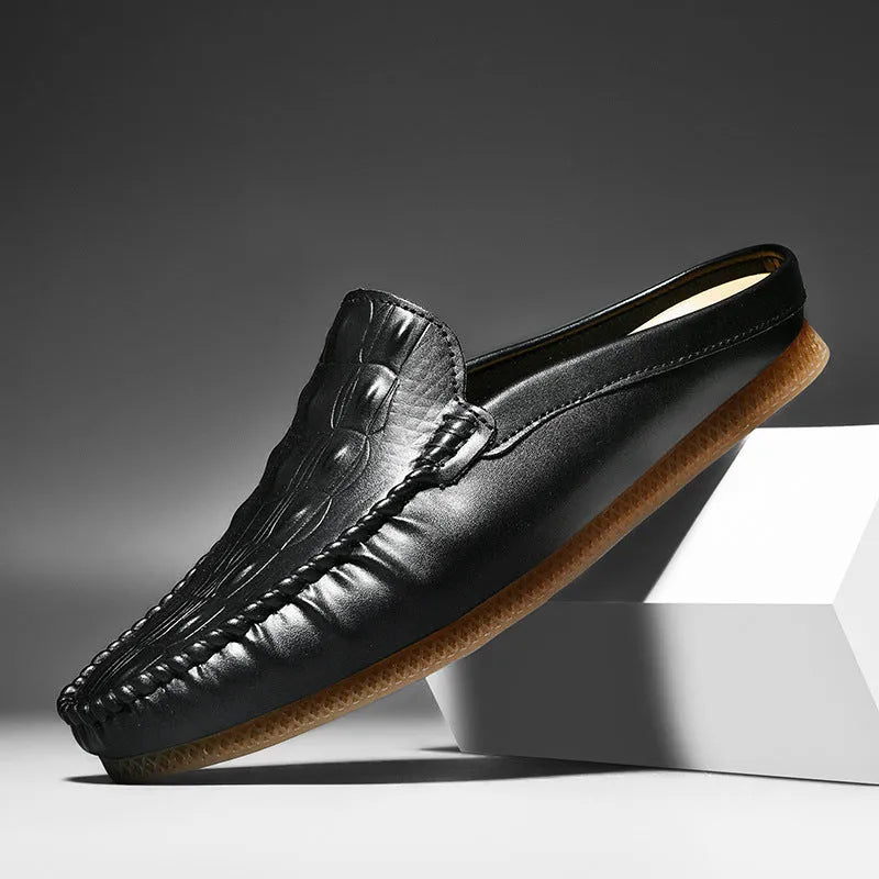Men's black leisure semi-slipper with Gommino rubber sole and breathable artificial PU upper.