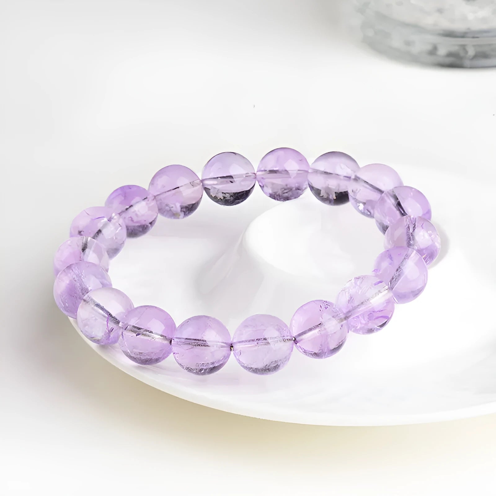 Lavender amethyst round bead bracelet with water ripple pattern showing cream and transparent colour options