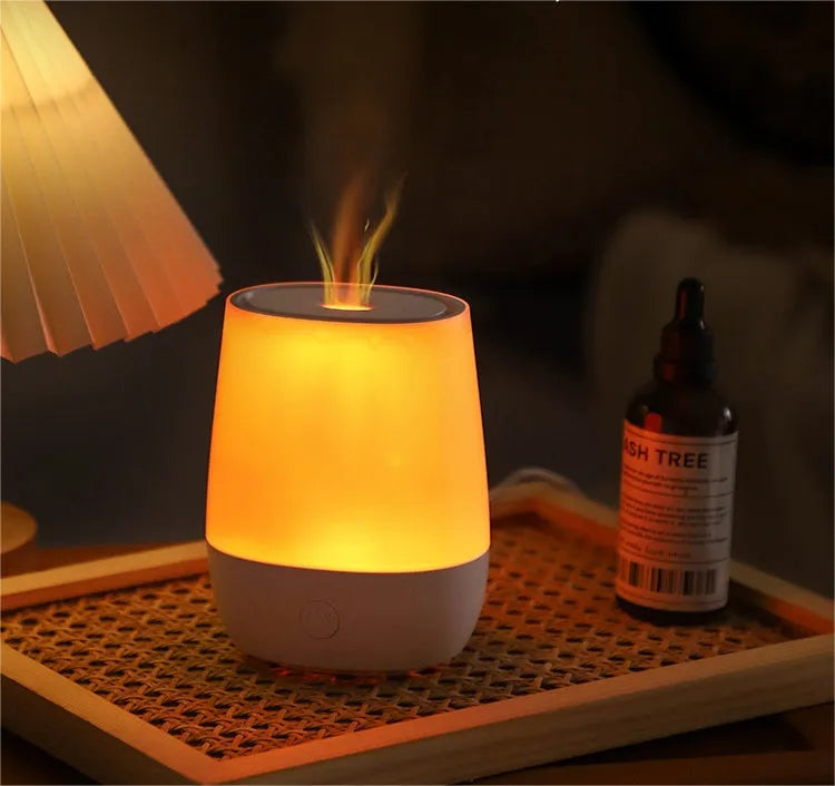 White USB aroma diffuser with simulated flame effect on wooden surface