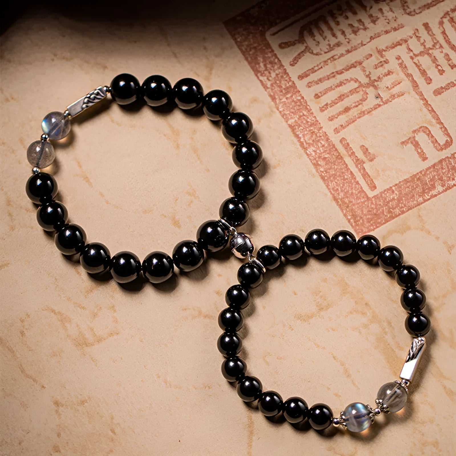 Obsidian Buddha beads couple bracelet DIY kit showing 8mm and 10mm beads for women's and men's spiritual jewellery