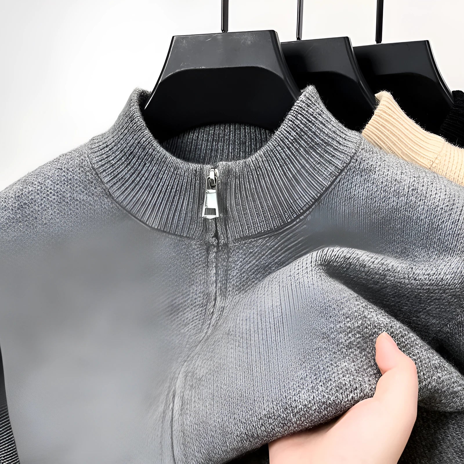 Men's loose grey knitted cardigan with a stand collar and a front zipper.