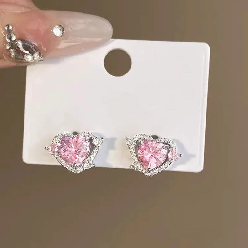 Women's electroplated copper heart stud earrings with white K colour finish and butterfly clutch fastenings