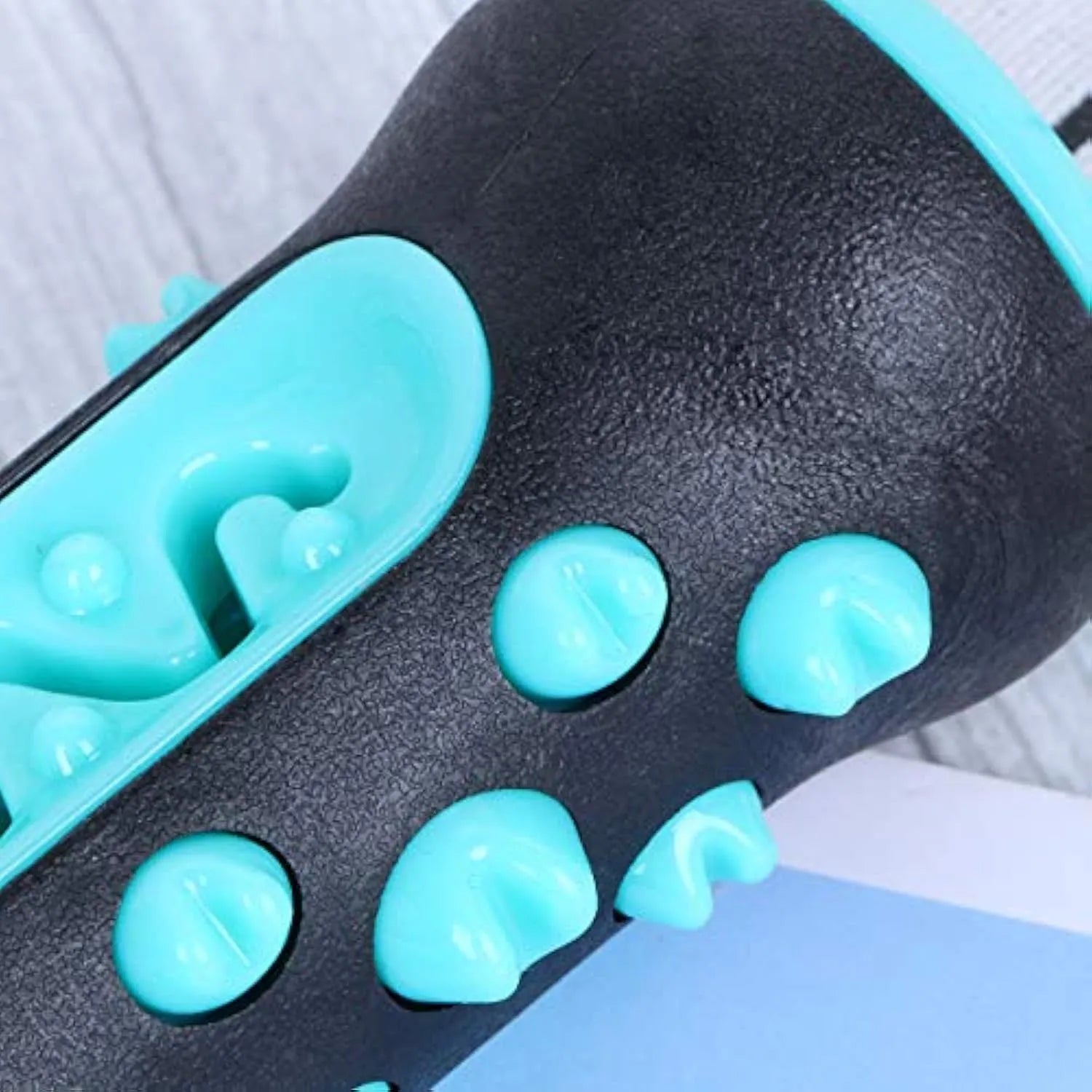 A natural rubber dog toothbrush chew toy in blue colour, showing its textured surface and stick shape.