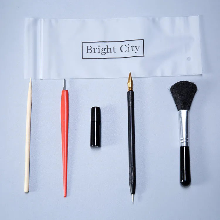 Scraping painting tools kit with white card paper, scraping pens, brushes, and art accessories for scratch artwork