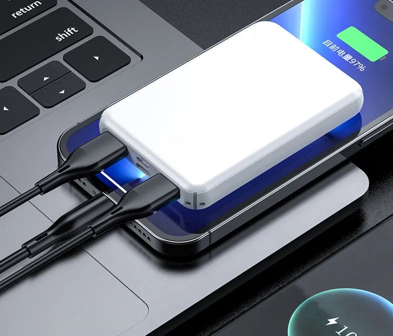 Black and white universal USB power bank for heated vests, showing compact size