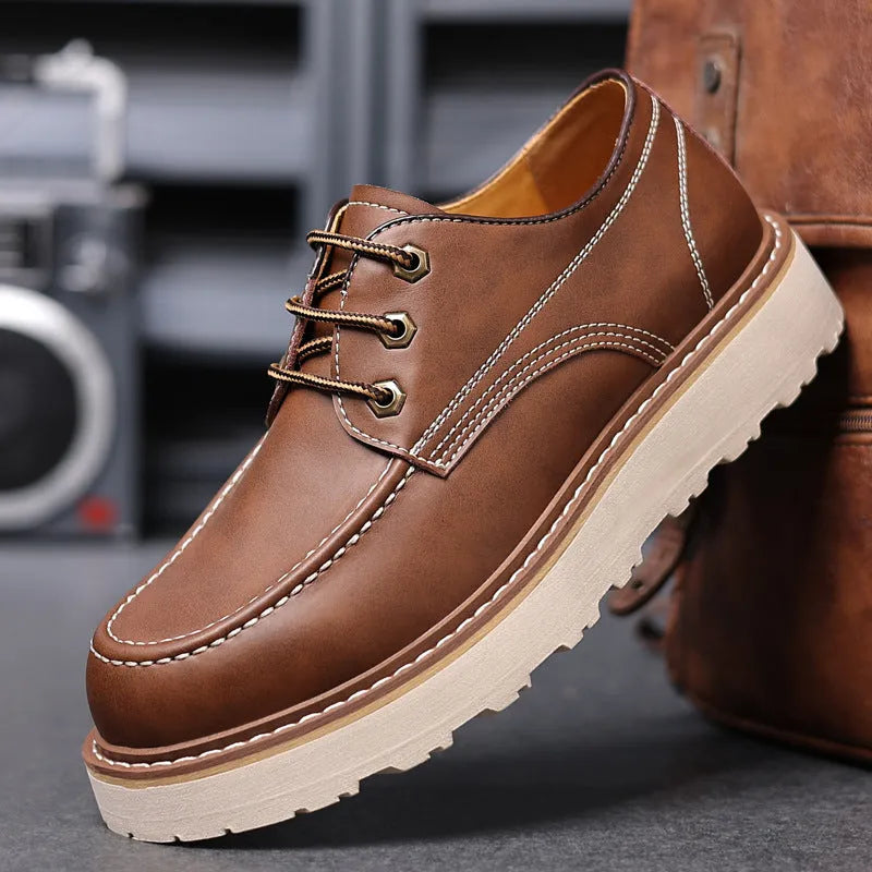 Men's black retro-style Martin boots with a round toe and mid-height rubber sole.