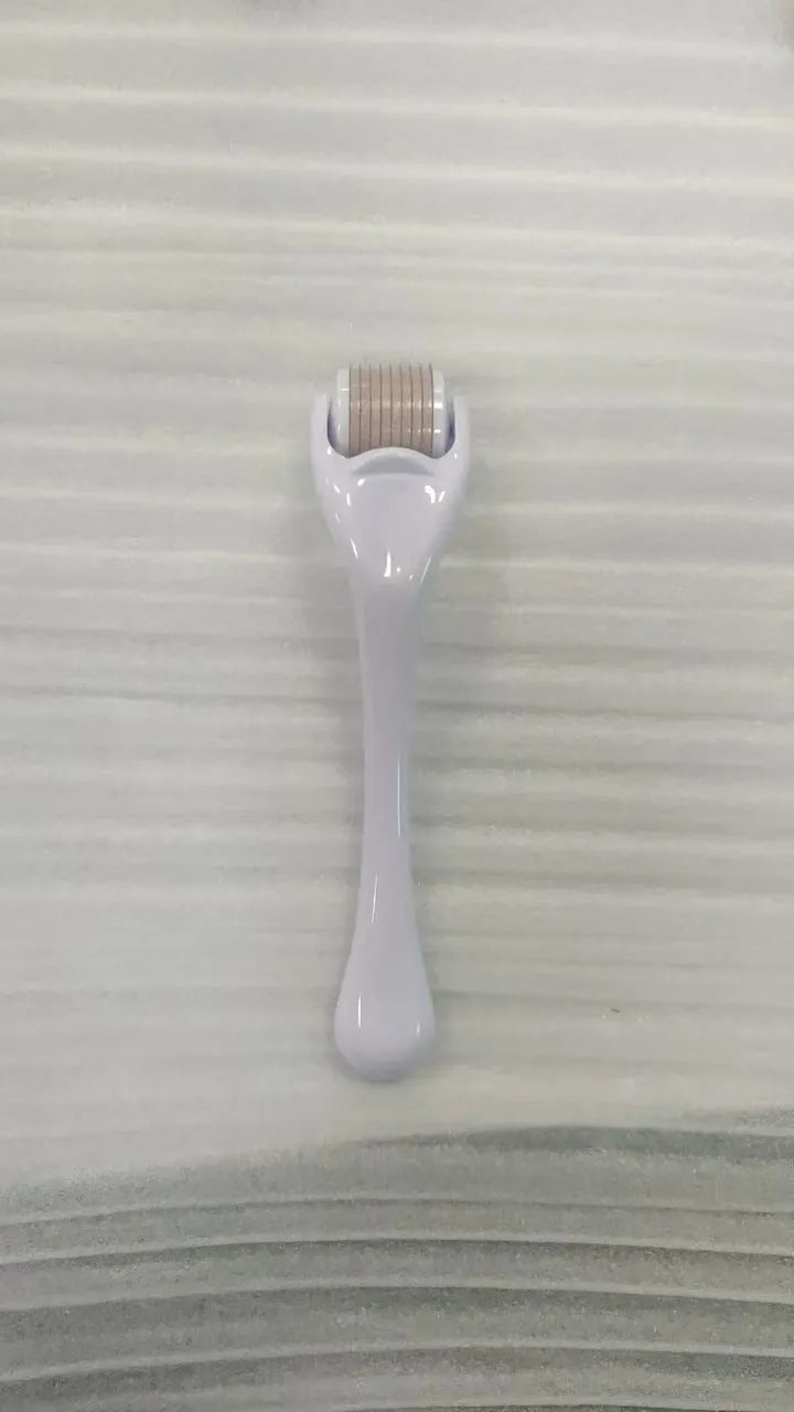 540 needle micro roller dermaroller with black handle and purple wheel, showing needle depth settings.