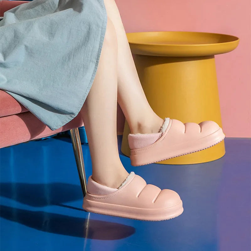 A pair of green EVA couple slippers with plush lining, shown as indoor house shoes and outdoor garden overshoes.