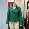 Black punk-style short jacket with a Peter Pan collar and a belt detail on the lapel.
