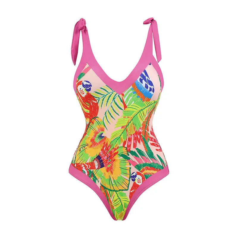 Women's pink floral print one-piece swimsuit with V-neck and a separate cover-up skirt.
