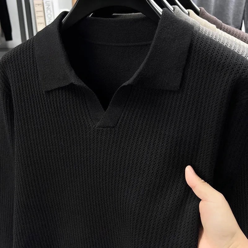 Man wearing a loose-fit green casual pullover sweater for autumn leisure.