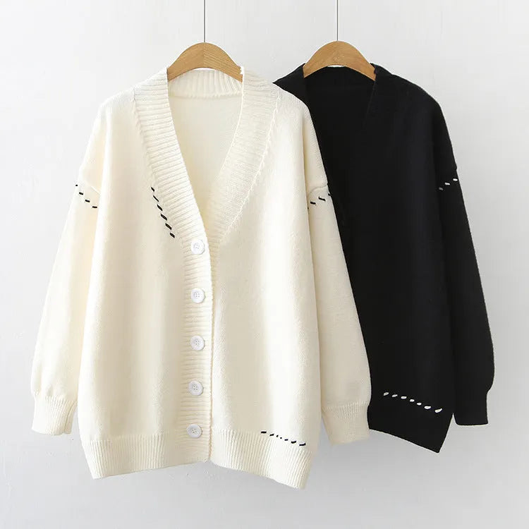 Women's loose fit knitted cardigan coat in black or white with long sleeves