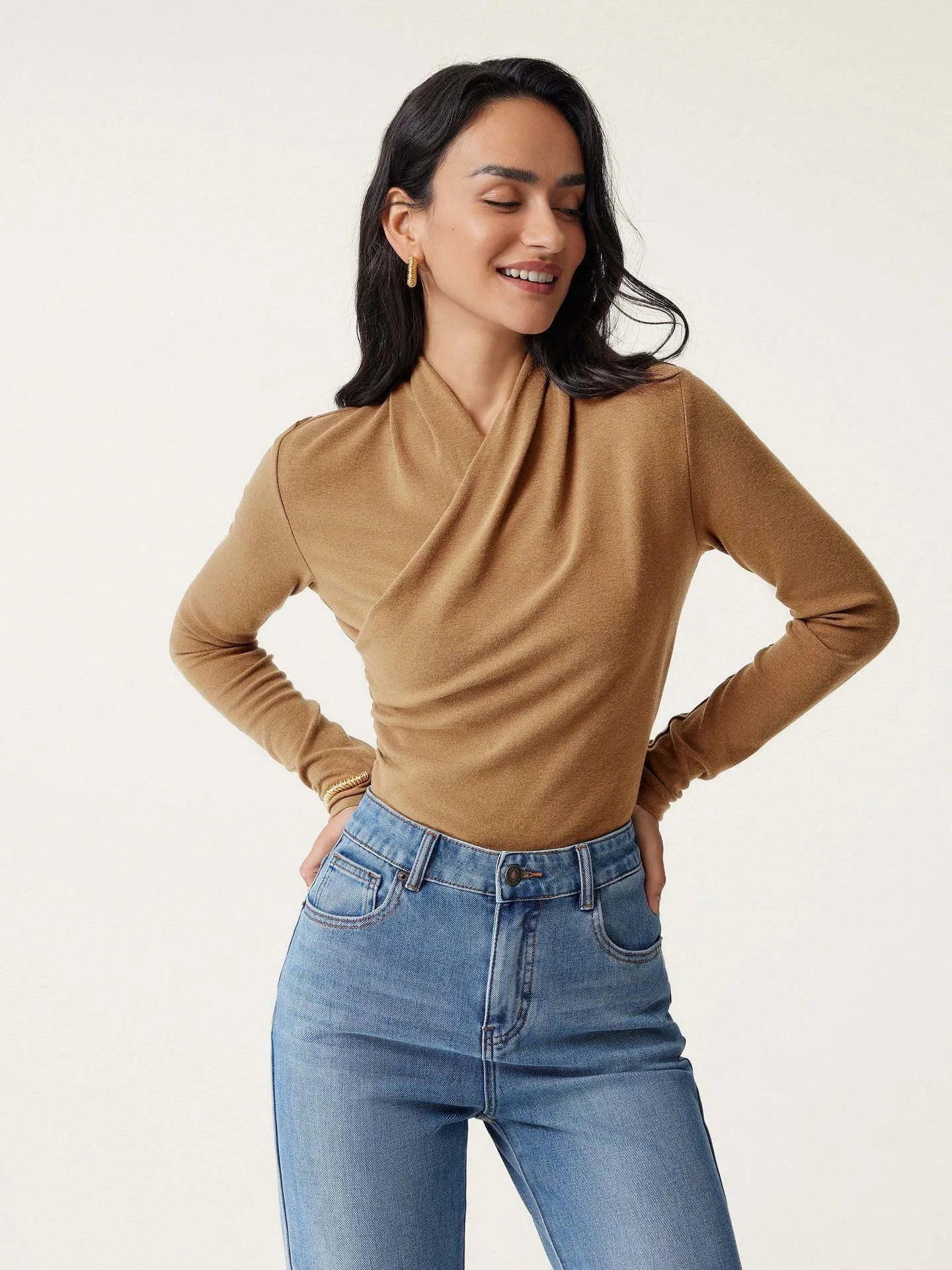 Women's slim fit camel pullover sweater with long sleeves on hanger