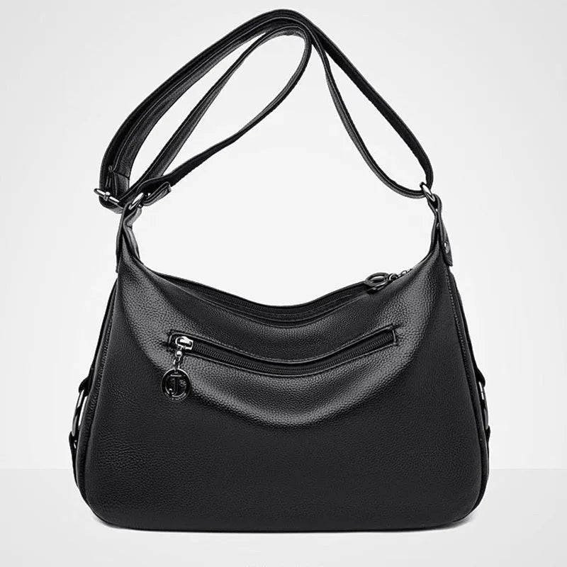 Blue women's large crossbody shoulder bag with multiple internal compartments and soft horizontal square design
