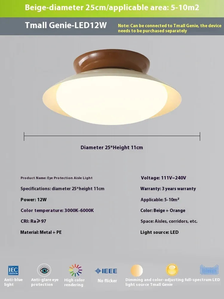 Modern flying saucer shaped ceiling lamp with an iron shade, shown in a cream yellow finish.