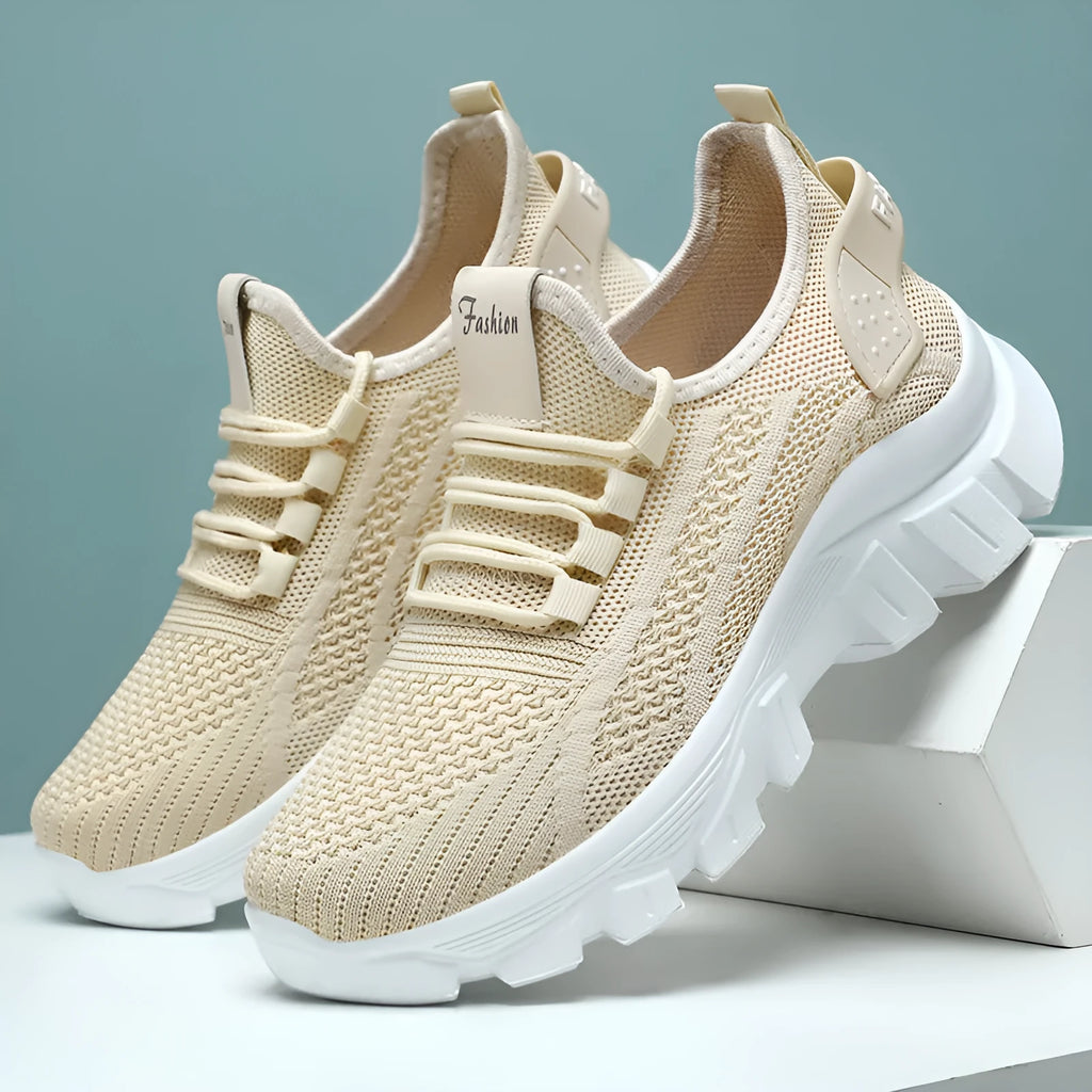 Women's white Flyknit sneaker with thick PVC sole and round toe lace-up design