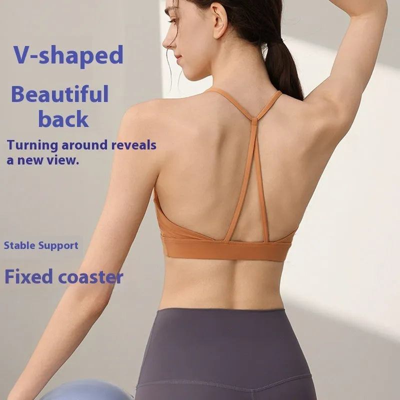 Women's black nylon sports vest with double shoulder straps for running and gym workouts.