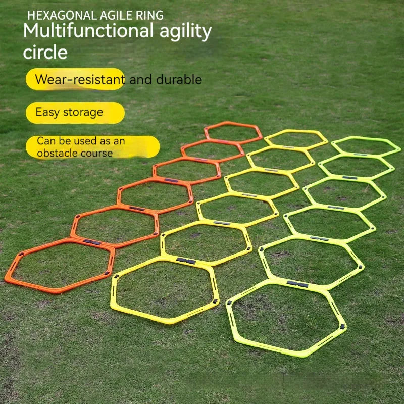 Set of six foldable yellow green and orange hexagon football agility training rings on grass.