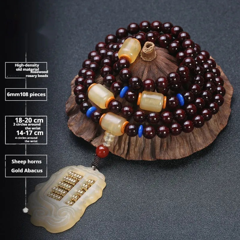 Men's rosewood 108 bead mala bracelet with a turquoise gemstone decorative centrepiece.
