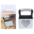 Stainless steel potato wave knife with serrated blade on a kitchen counter.