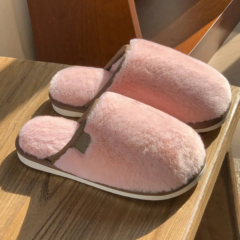 PVC non-slip winter slipper in a solid colour on a wooden floor.