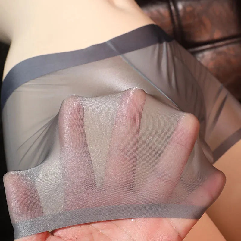 Men's solid colour ultra-thin transparent nylon ice silk boxer shorts on a size chart.