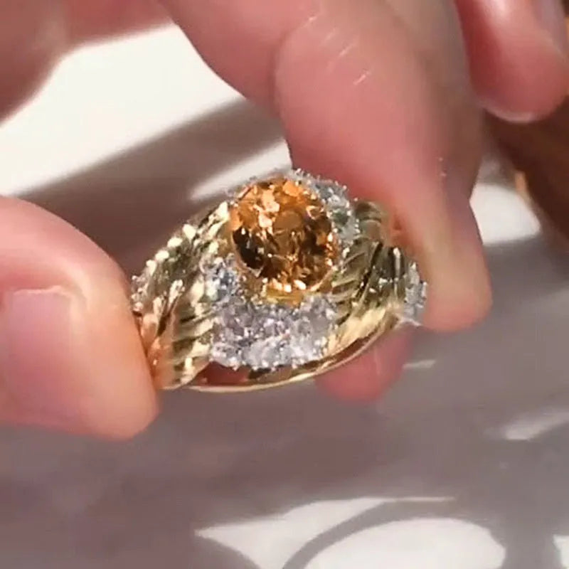 Women's gold geometric feather ring with yellow zircon stones on copper band