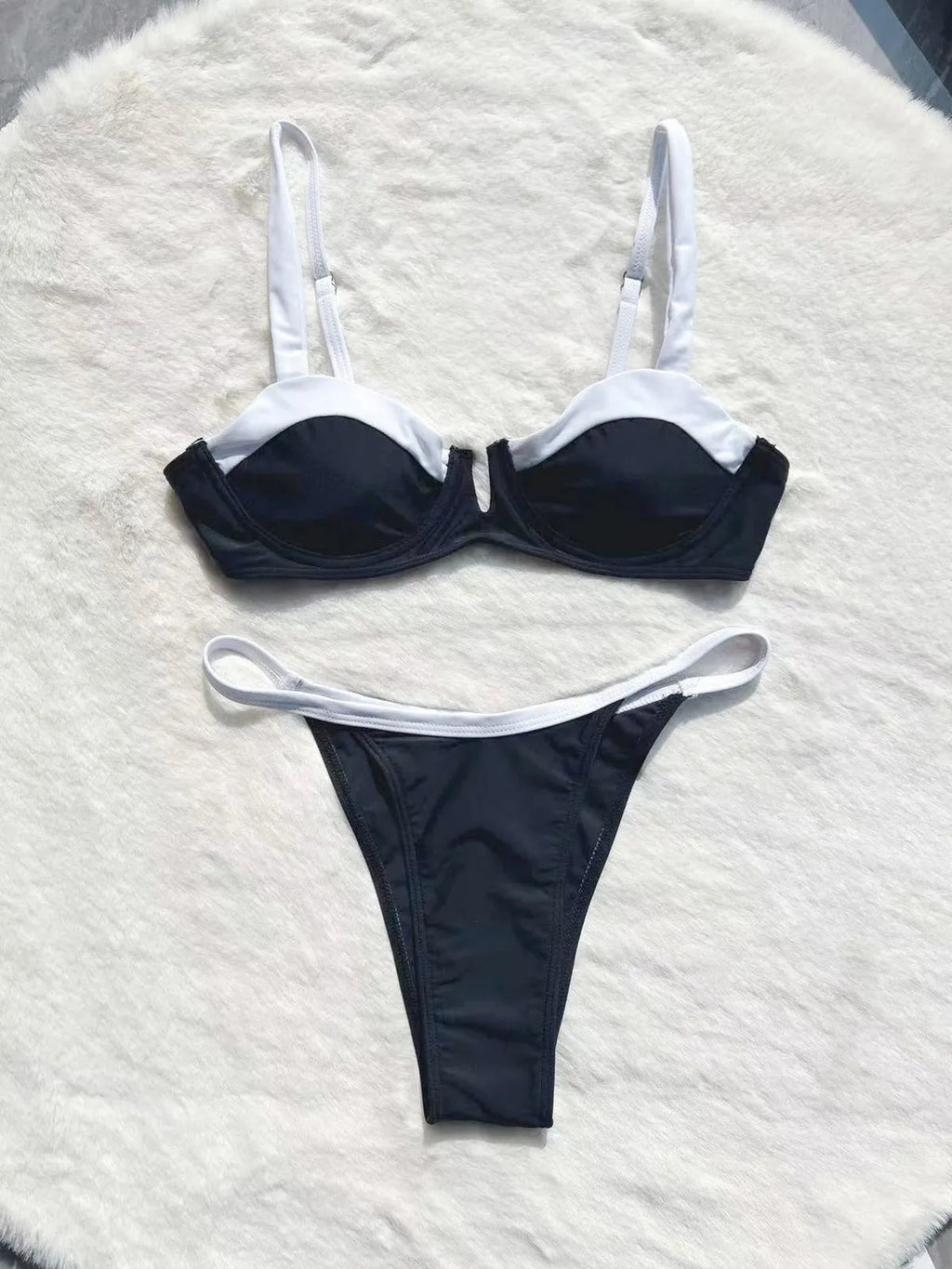 Black low waist women's bikini swimsuit with stitching split detail on the briefs
