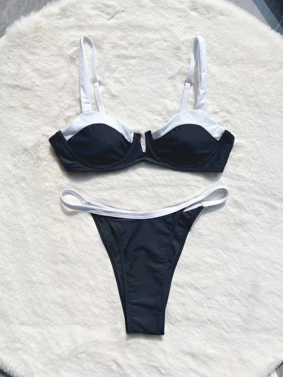 Black low waist women's bikini swimsuit with stitching split detail on the briefs