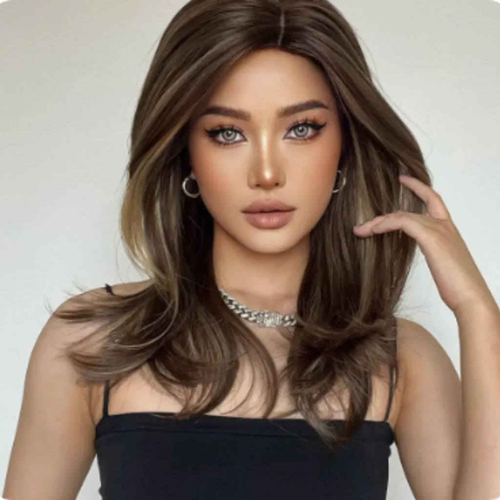 Mid-length platinum gradient colour wig with curly hair and fringe on model