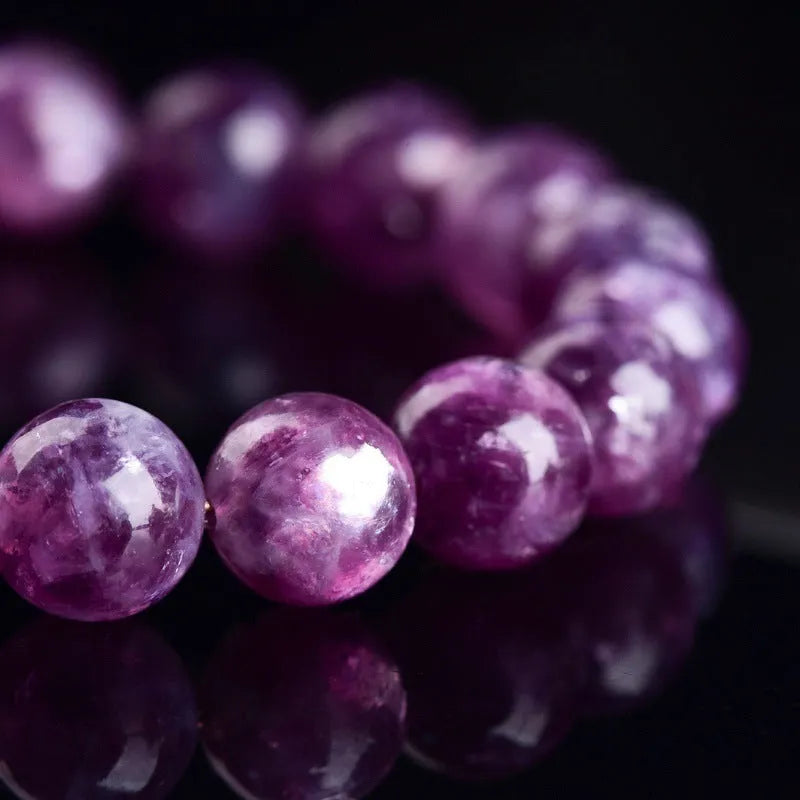Purple grandmother crystal bracelet with polished geometric beads on wrist