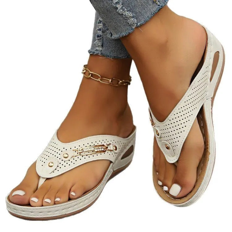 Women's retro-style flip-flop sandals in beige with PU upper and EVA sole, showing herringbone footbed texture.