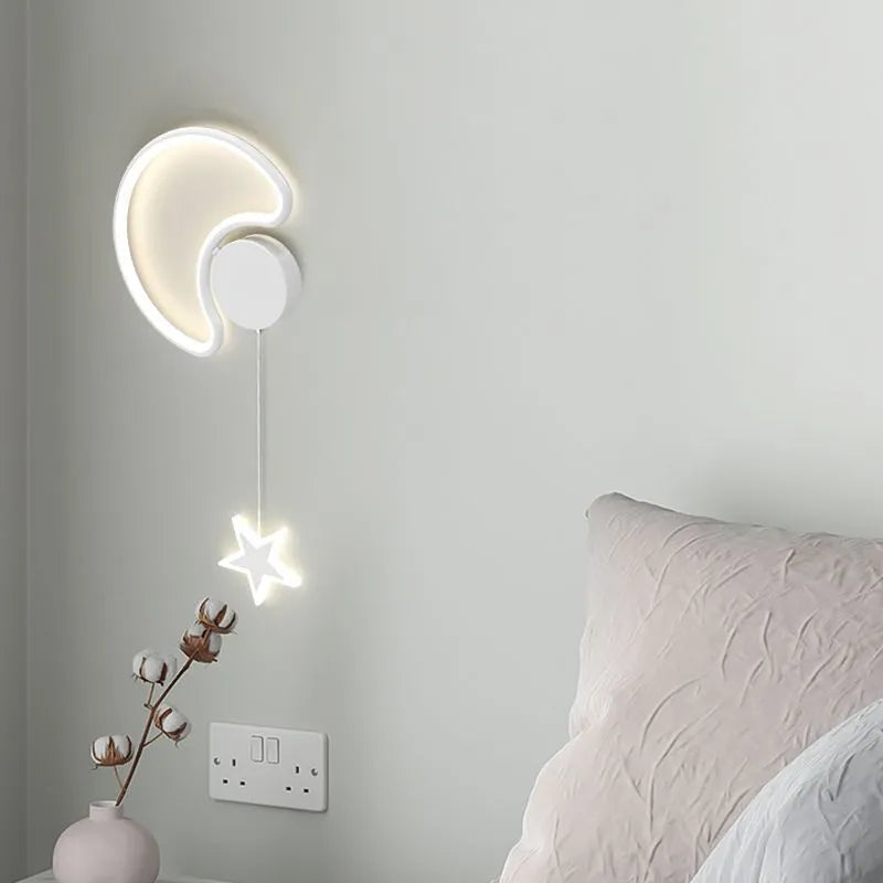 Children's bedside wall lamp with cloud and star design in black finish showing three-colour LED illumination